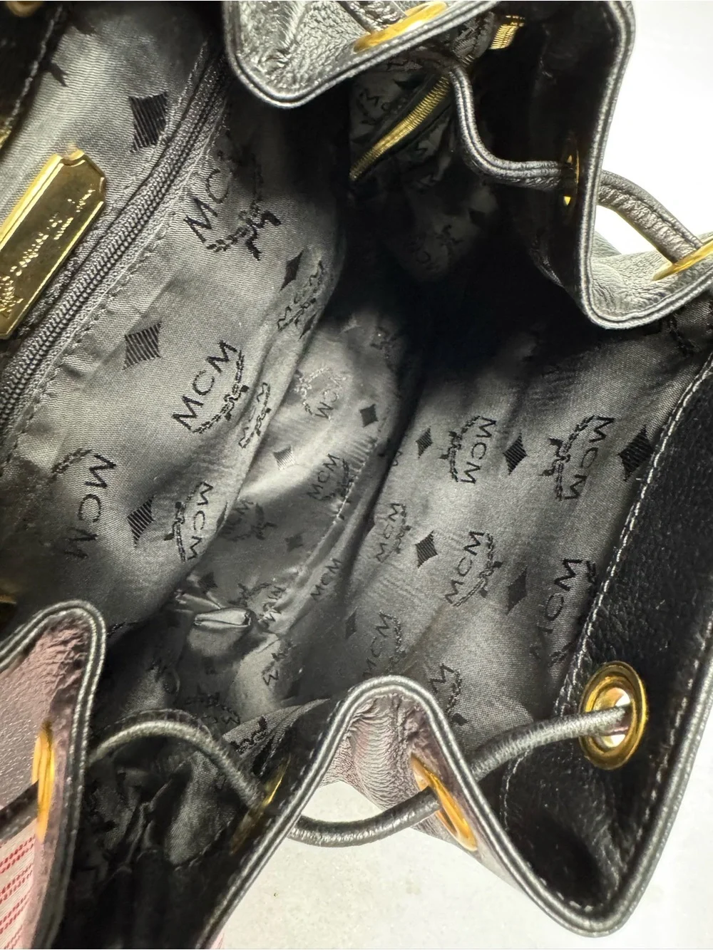 MCM Black Leather Backpack with Gold Logo Accents